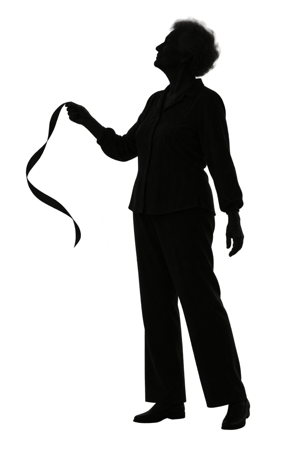 An older adult holding a ribbon that moves with the wind.